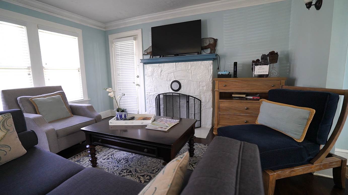 Room with fireplace and tv